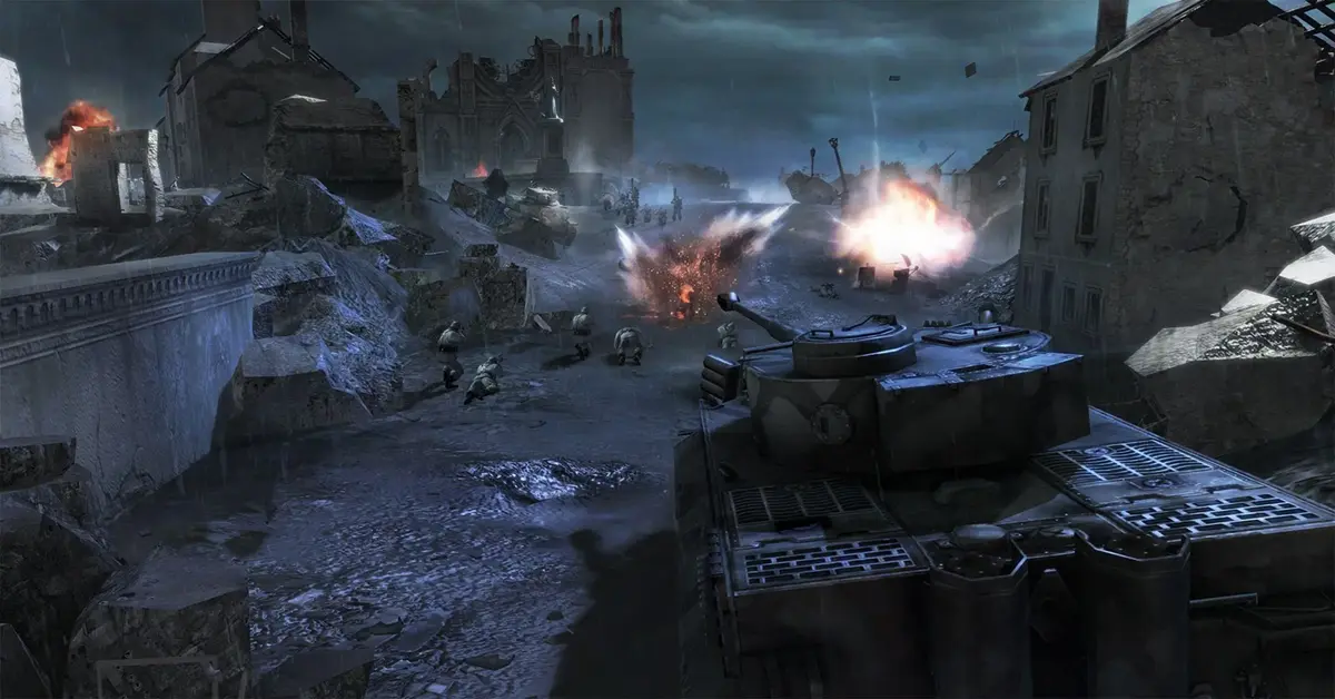 Strategic battlefield overview in Company of Heroes showing armor and infantry coordinating near ruined buildings.