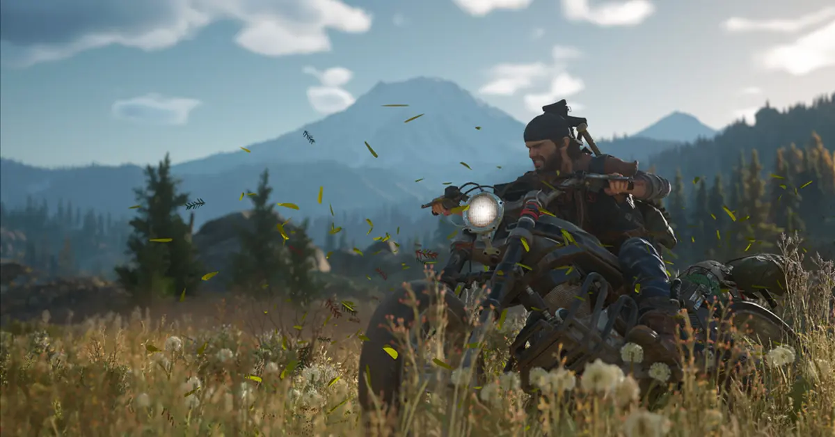 Deacon St. John riding his heavily modified drifter bike through a lush but dangerous Pacific Northwest forest in Days Gone.