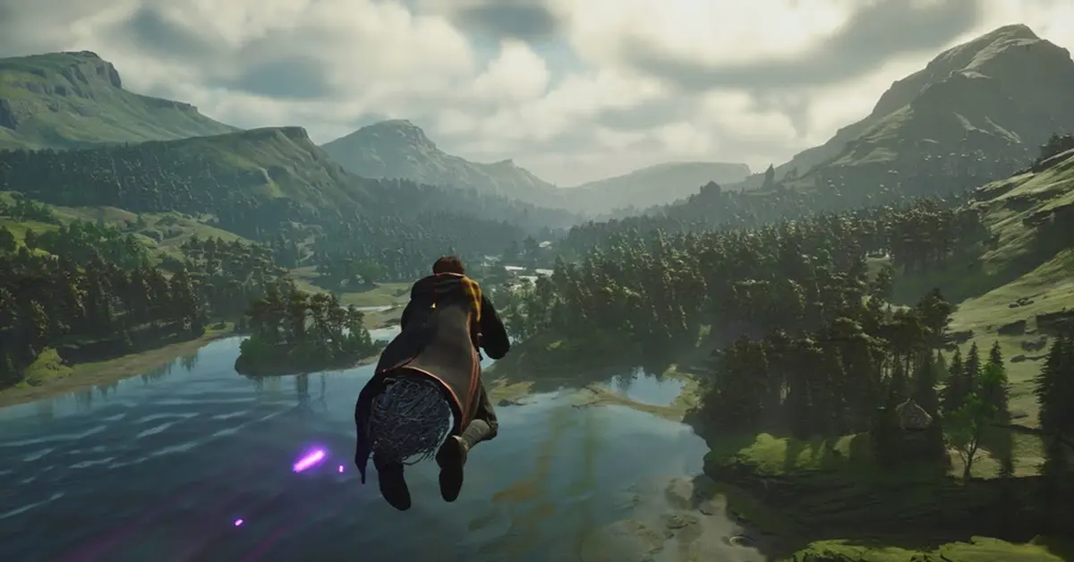 A player character flying on a broomstick over the Scottish Highlands in Hogwarts Legacy