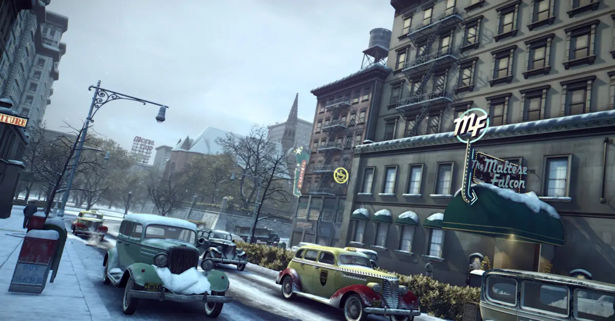 Vito Scaletta walking down a snowy street in Empire Bay in Mafia II: Definitive Edition