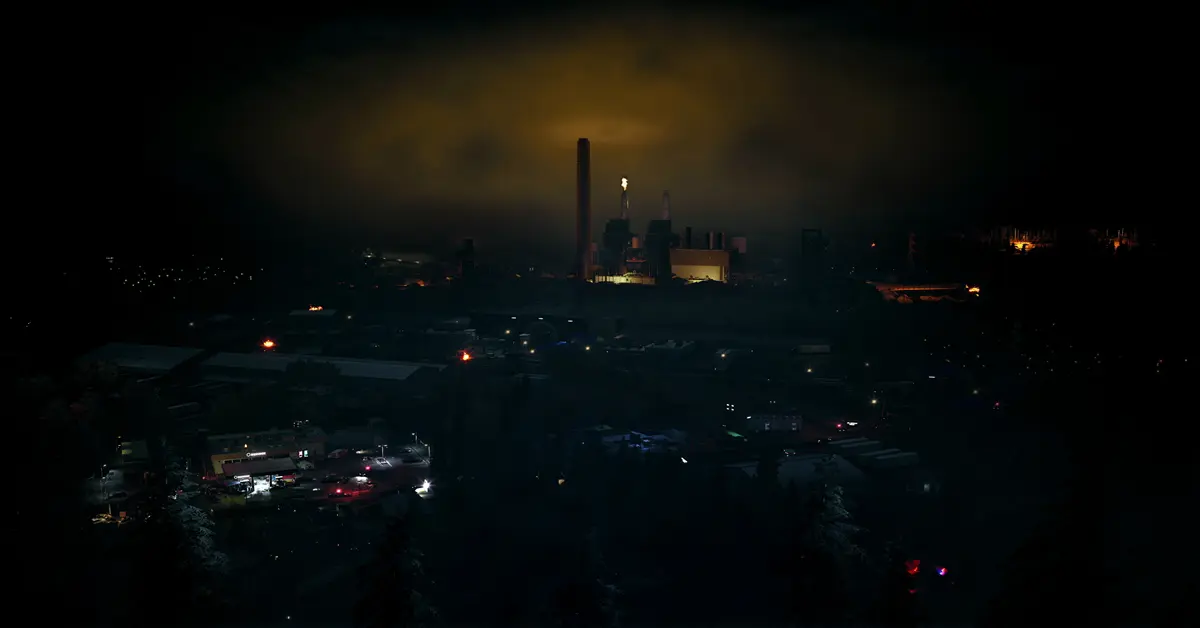 A survivor navigating a dark industrial complex in No More Room in Hell 2