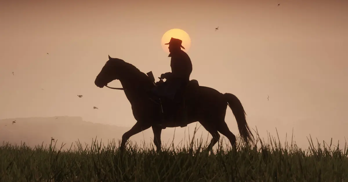 Arthur Morgan on horseback during a sunset in Red Dead Redemption 2.