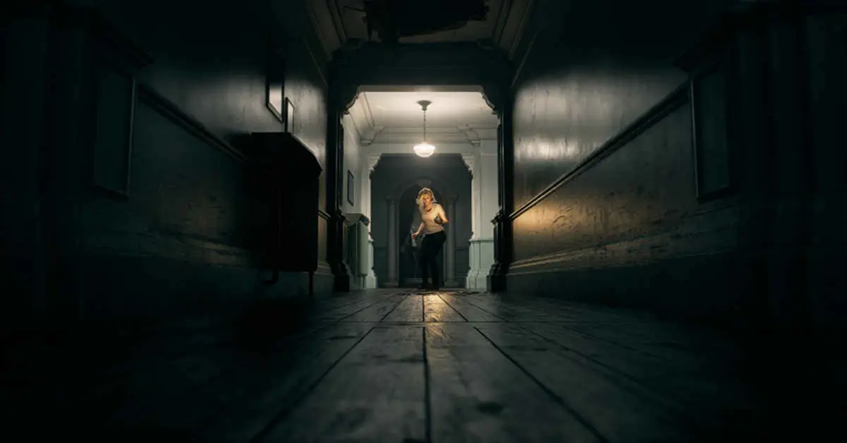 Resident Evil Requiem protagonists Leon Kennedy and Grace Ashcroft in a dark hallway.