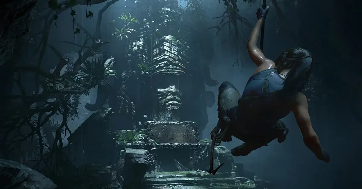 Lara Croft exploring a massive ancient tomb in Shadow of the Tomb Raider.