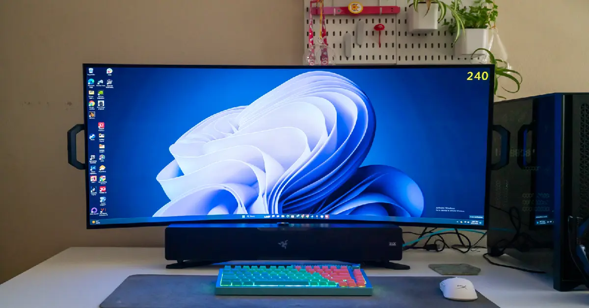 High-end custom PC build displaying the Windows 11 Pro interface on a curved gaming monitor